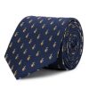 Silk tie with white and red polka dots on a navy blue background.